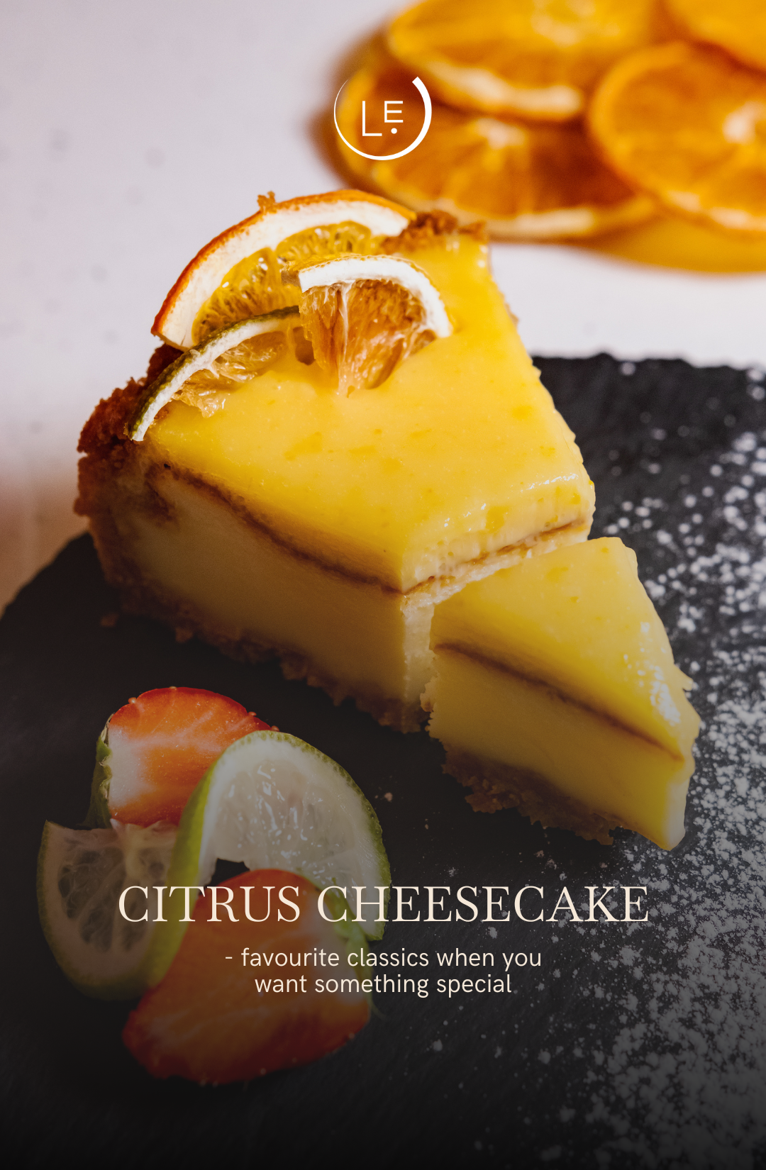 Slice of citrus cheesecake with decorative elements on a dark surface